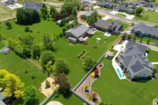 580 North 300 East Logan, UT 84321 - Photo 10 of 74 Expansive aerial capturing multiple residences and substantial green spaces