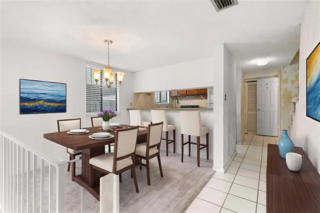 a view of a dining room with furniture and window
