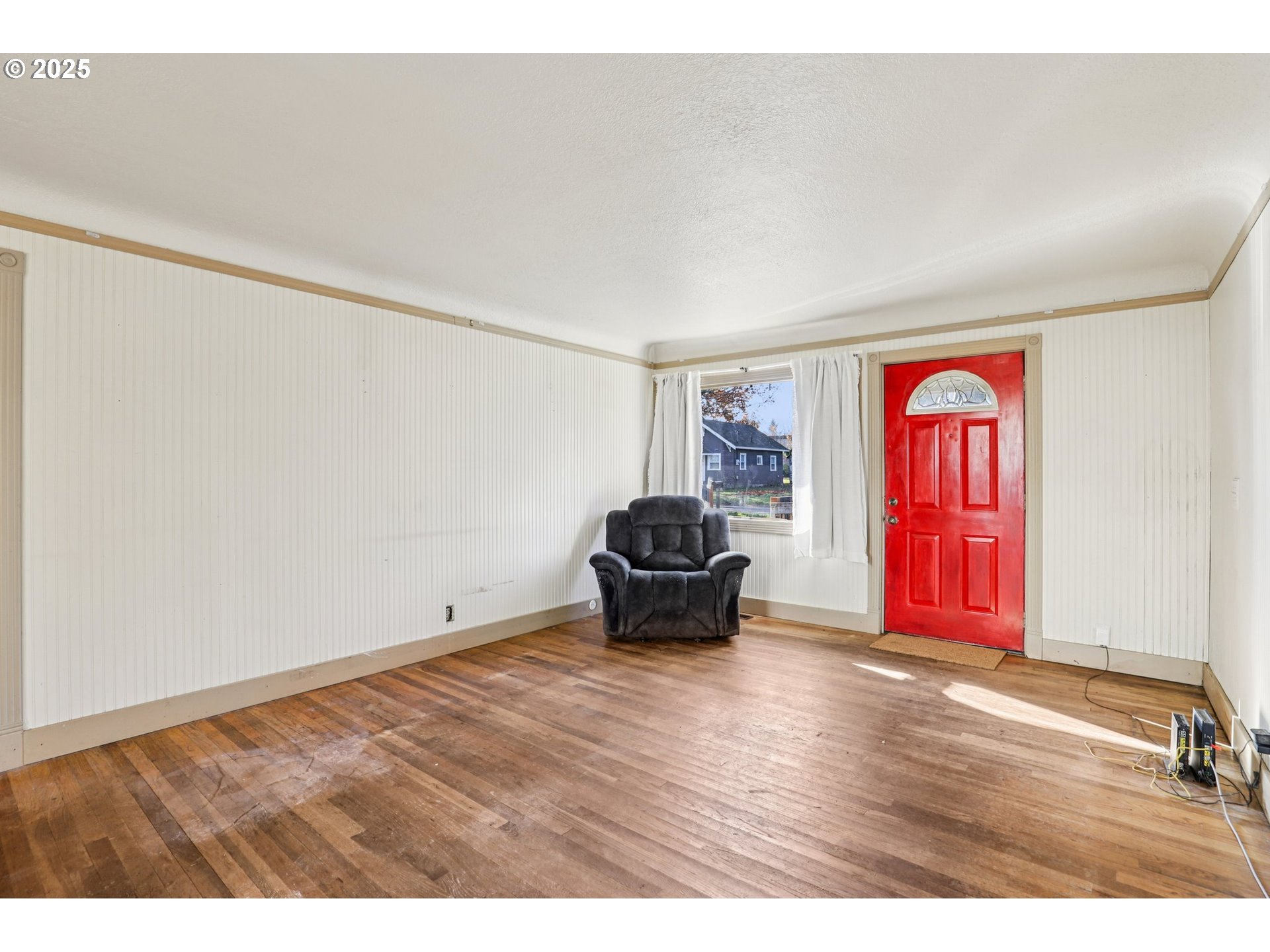 224 Northeast 92nd Place Portland, OR 97220 - Photo 12 of 43 a view of an empty room with wooden floor