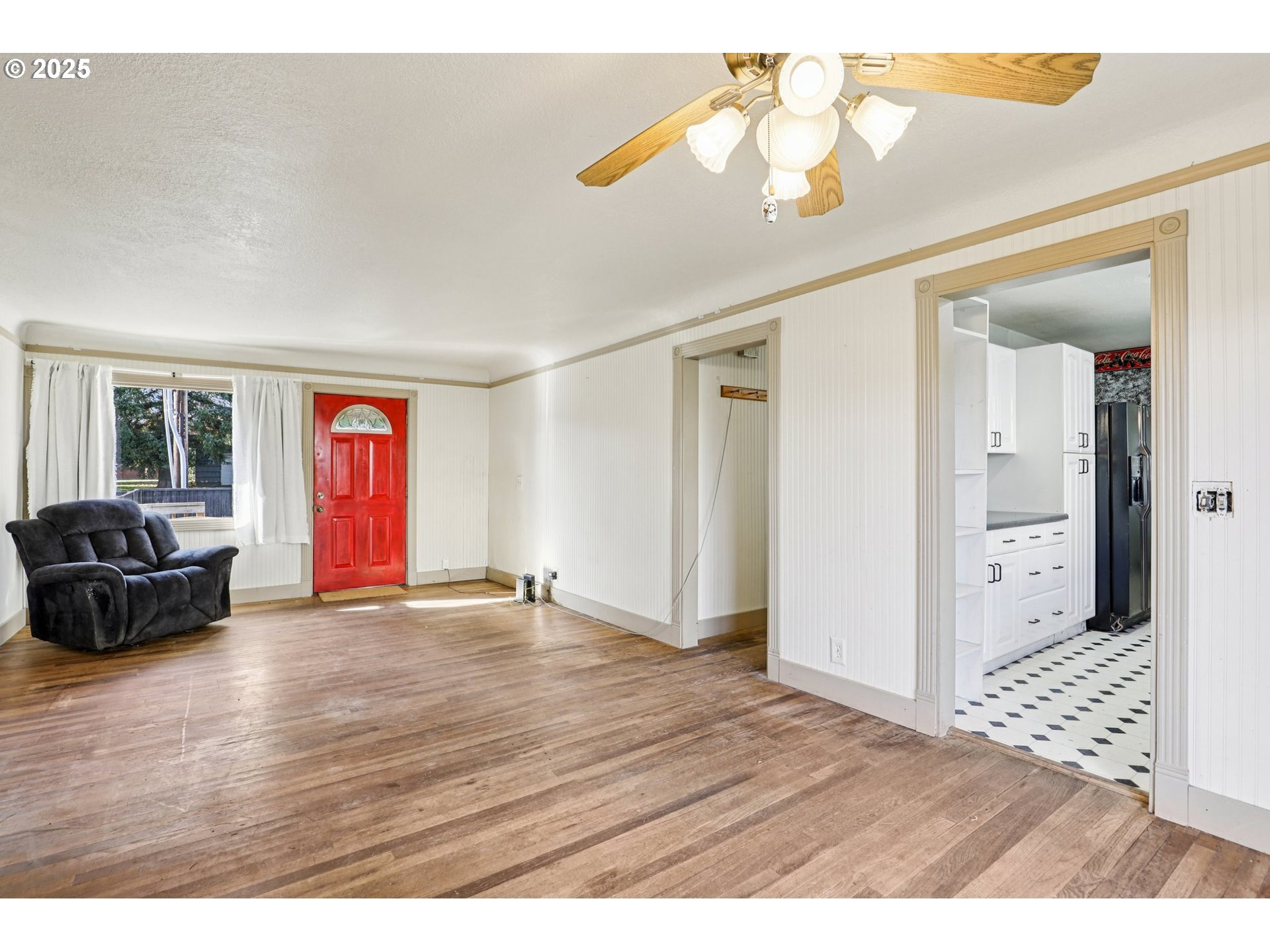 224 Northeast 92nd Place Portland, OR 97220 - Photo 13 of 43 a view of an empty room with window and wooden floor