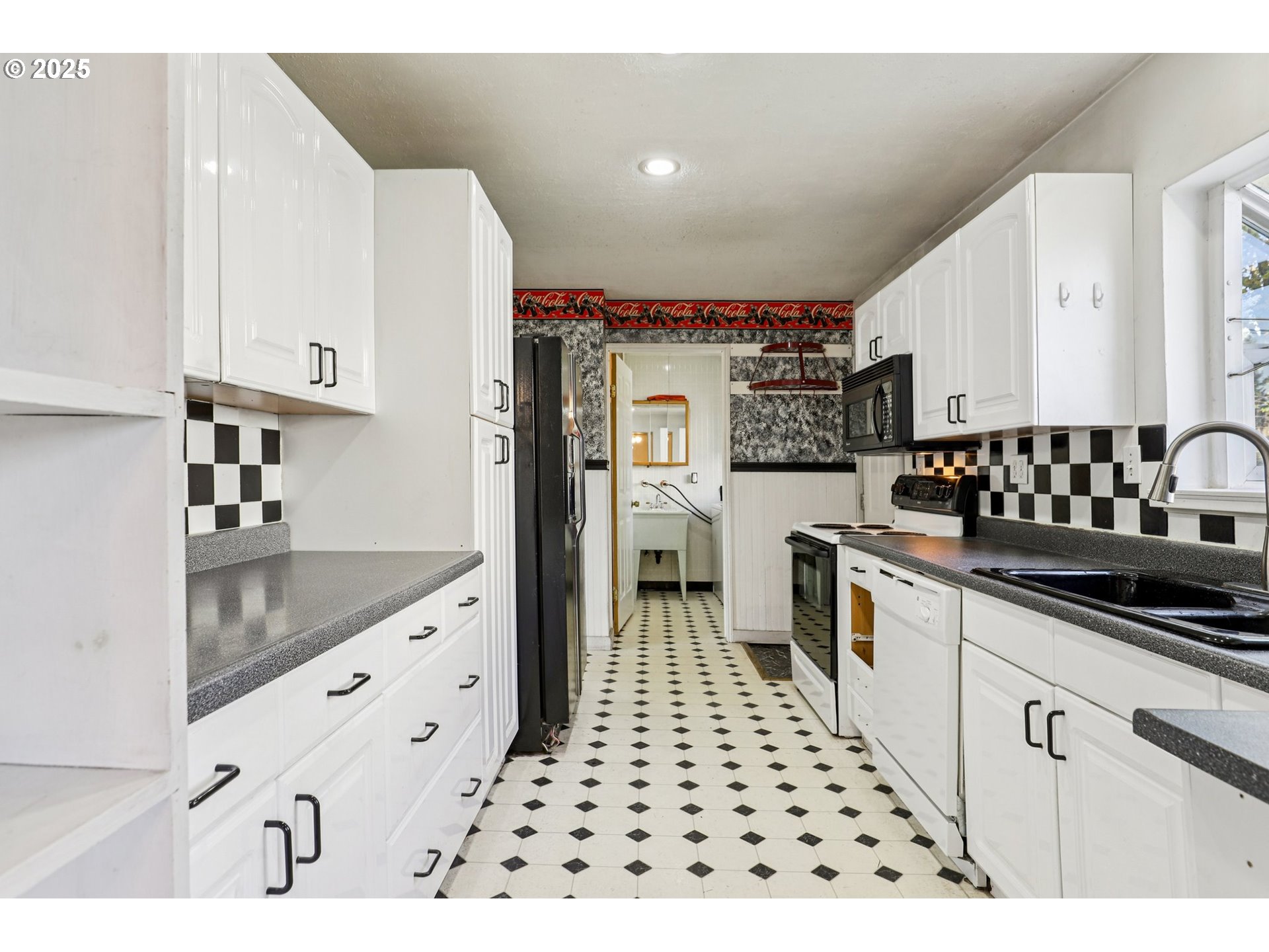 224 Northeast 92nd Place Portland, OR 97220 - Photo 14 of 43 a kitchen with granite countertop a sink a stove and cabinets