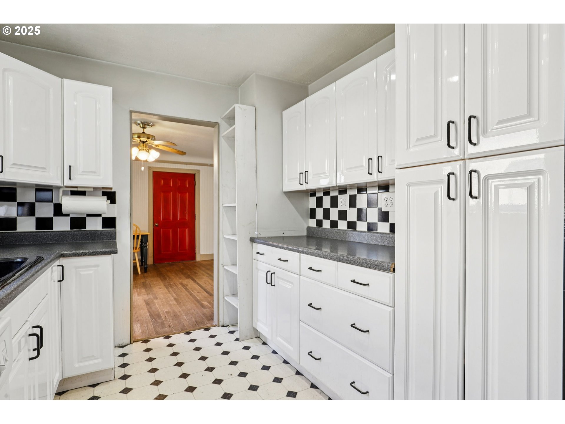 224 Northeast 92nd Place Portland, OR 97220 - Photo 16 of 43 a kitchen with granite countertop a sink a stove and cabinets