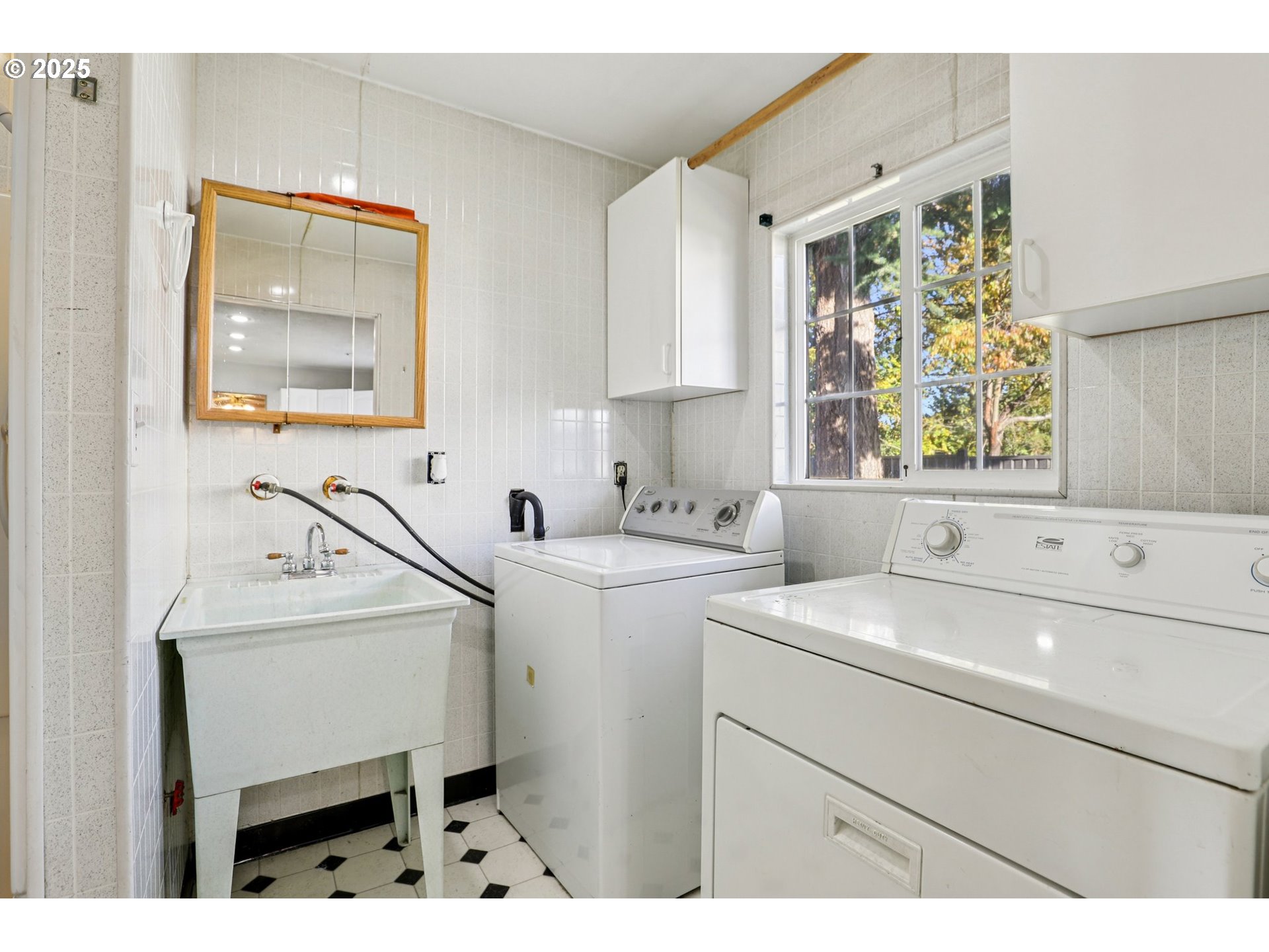 224 Northeast 92nd Place Portland, OR 97220 - Photo 20 of 43 a utility room with closet a dryer and washer