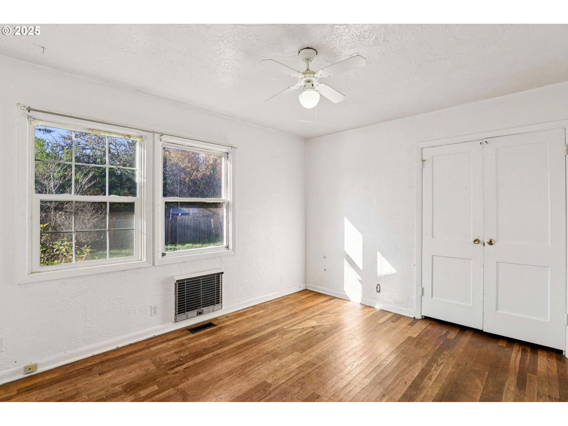 224 Northeast 92nd Place Portland, OR 97220 - Photo 28 of 43 a view of empty room with wooden floor and fan
