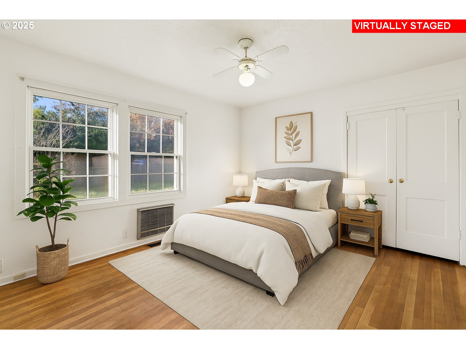 224 Northeast 92nd Place Portland, OR 97220 - Photo 29 of 43 a bedroom with a large bed and a potted plant