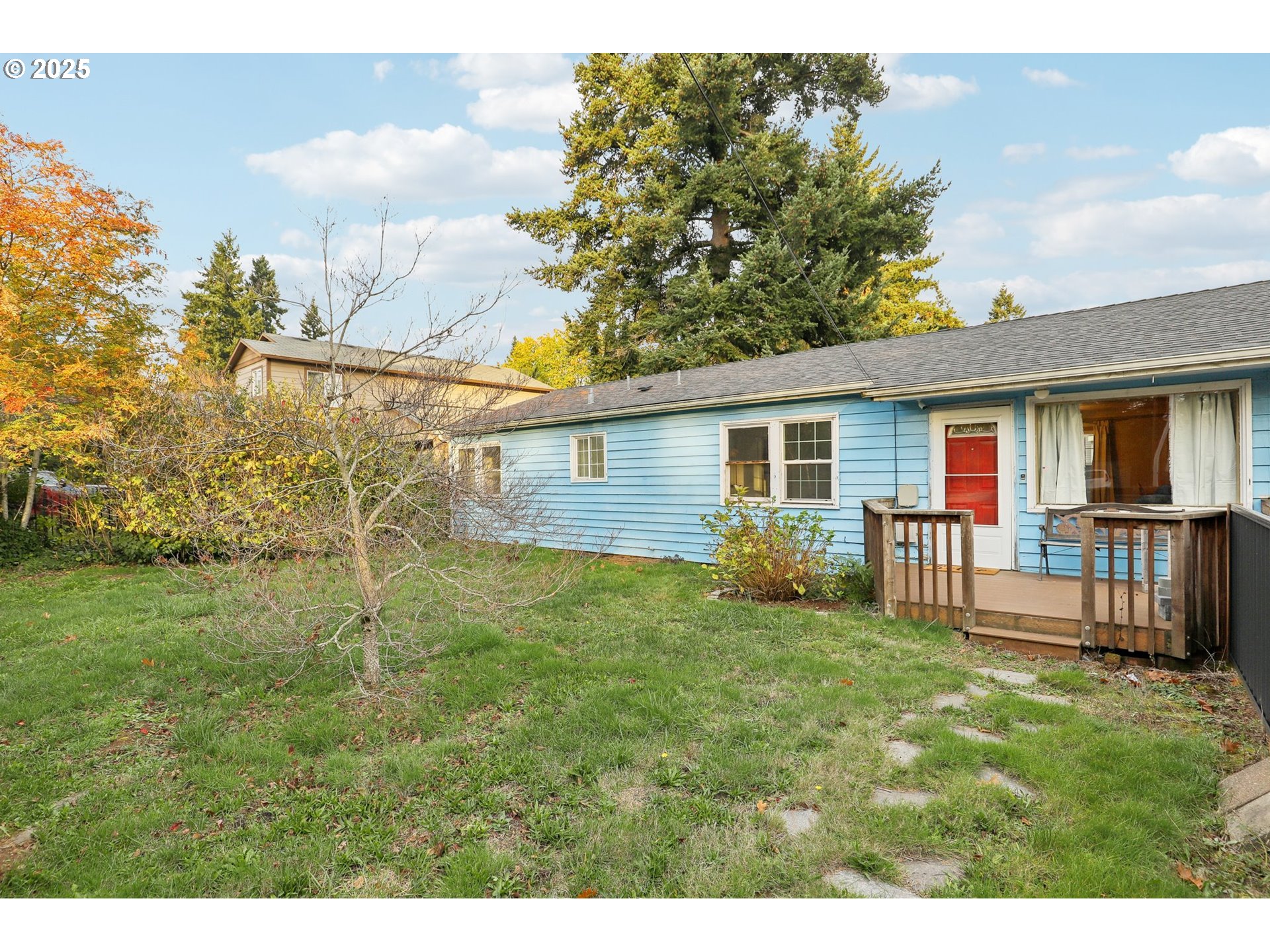 224 Northeast 92nd Place Portland, OR 97220 - Photo 4 of 43 a backyard of a house with table and chairs