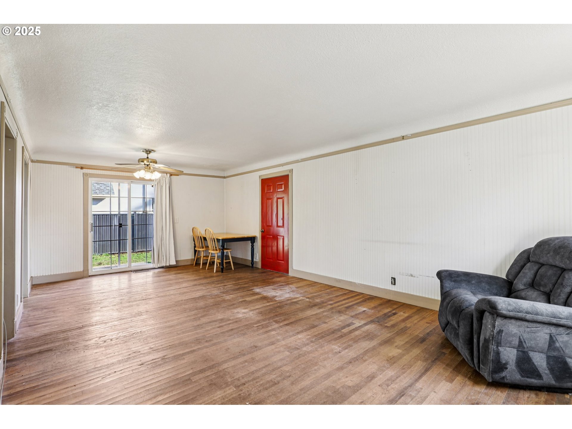 224 Northeast 92nd Place Portland, OR 97220 - Photo 9 of 43 a living room with furniture and a floor to ceiling window
