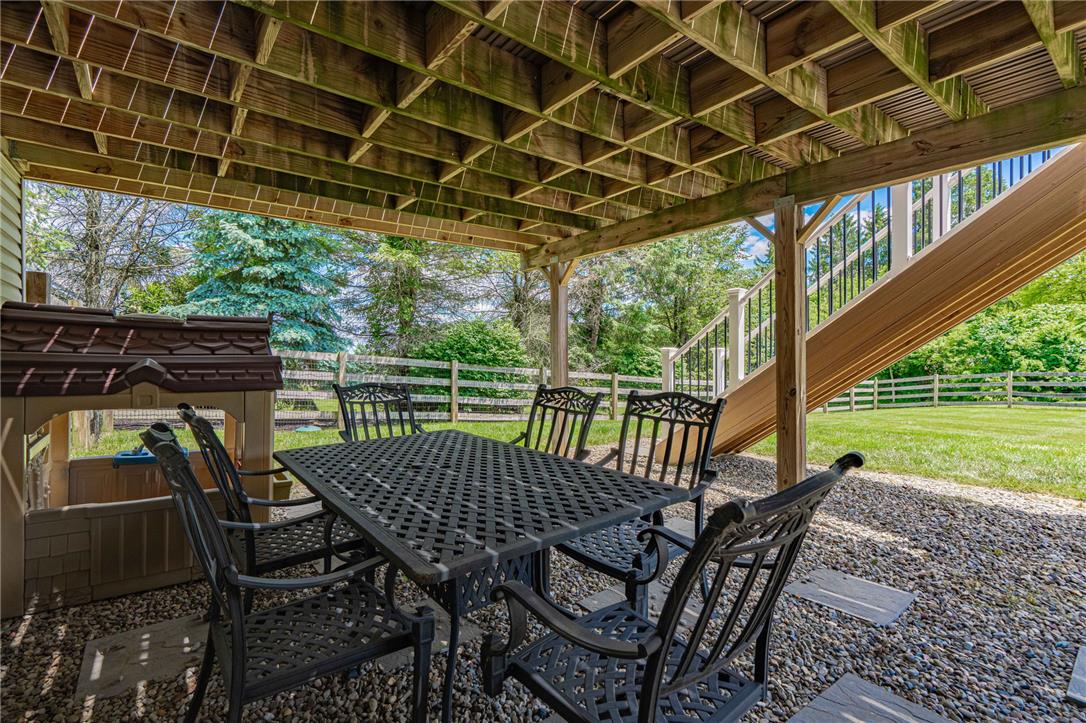 6000 Pond View Terrace Bath, PA 18014 - Photo 54 of 69 Enjoy outdoor gatherings with a covered patio area and fenced yard, offering privacy and a play space.