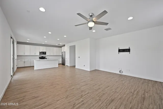 a view of kitchen with wooden floor and window
