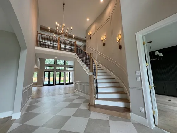 a view of entryway and hallway with a front door