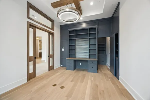 a view of empty room and wooden floor