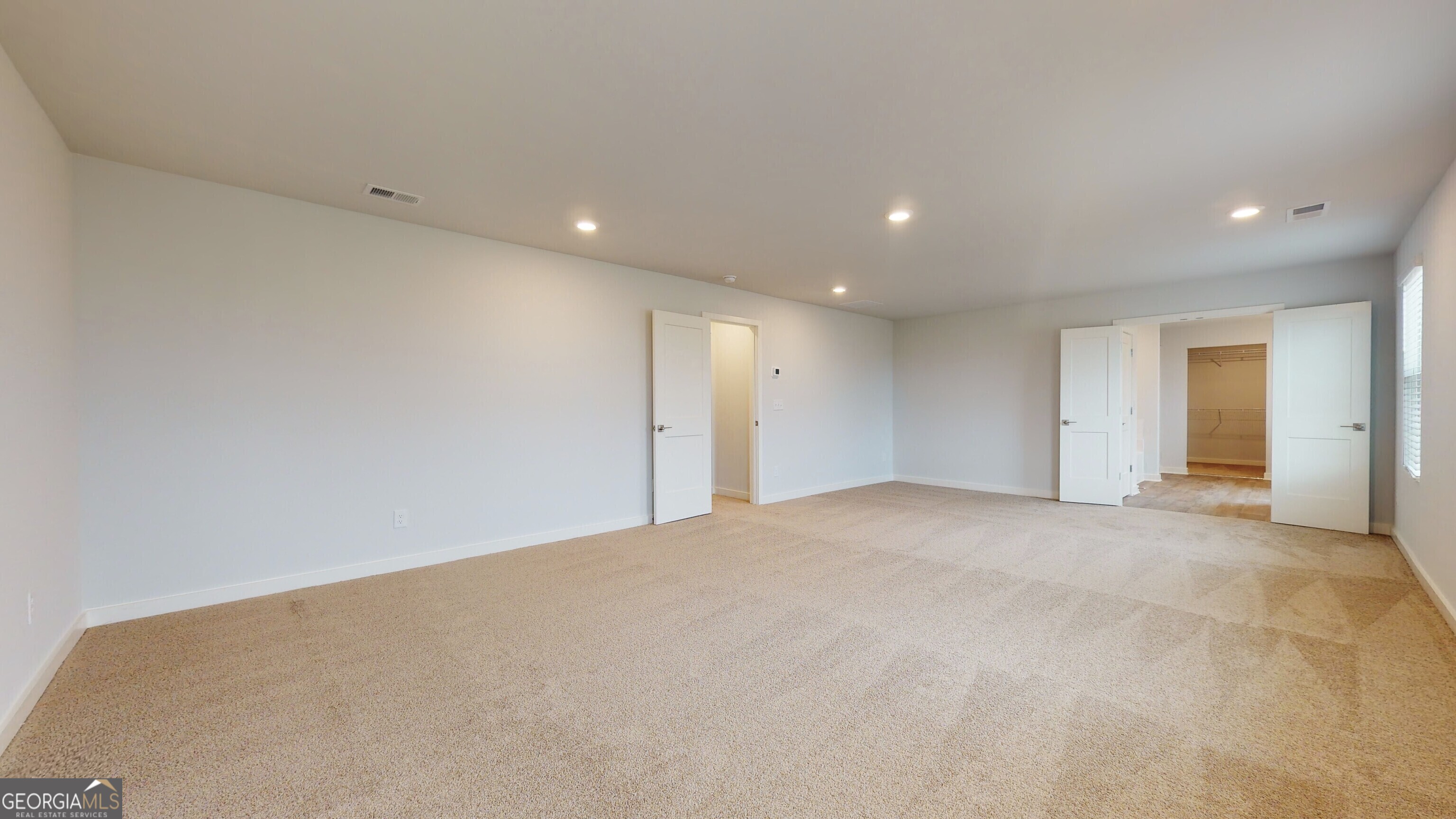 362 Jarrett Street, Unit 48 Fairburn, GA 30213 - Photo 9 of 18 a view of an empty room