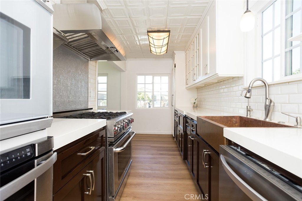 1118 East Joel Street Carson, CA 90745 - Photo 12 of 35 a kitchen with a stove and a sink