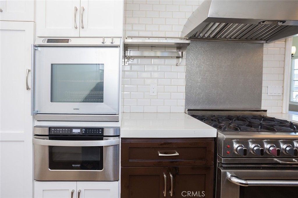 1118 East Joel Street Carson, CA 90745 - Photo 19 of 35 a stove top oven sitting inside of a kitchen