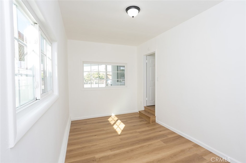 1118 East Joel Street Carson, CA 90745 - Photo 24 of 35 a view of empty room with wooden floor and fan
