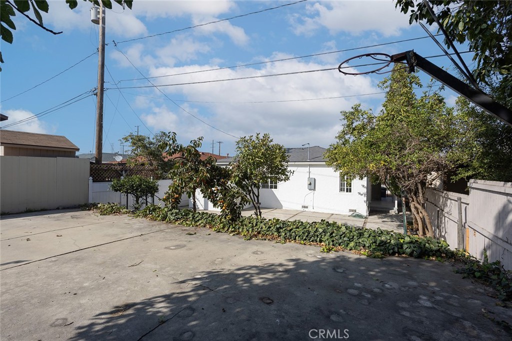 1118 East Joel Street Carson, CA 90745 - Photo 30 of 35 a front view of a house with a yard and garage