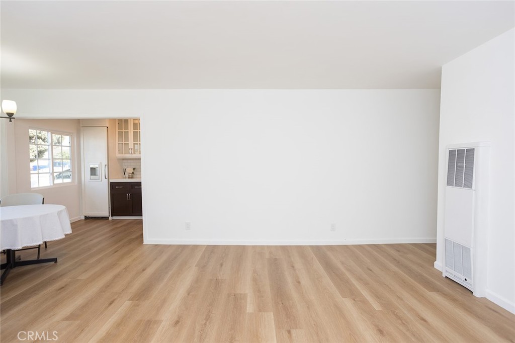 1118 East Joel Street Carson, CA 90745 - Photo 6 of 35 a view of wooden floor and windows in a room