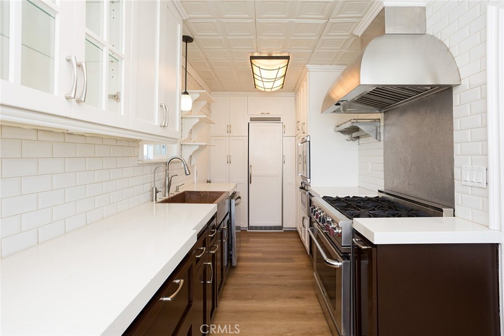 1118 East Joel Street Carson, CA 90745 - Photo 10 of 35 a kitchen with a stove and a sink