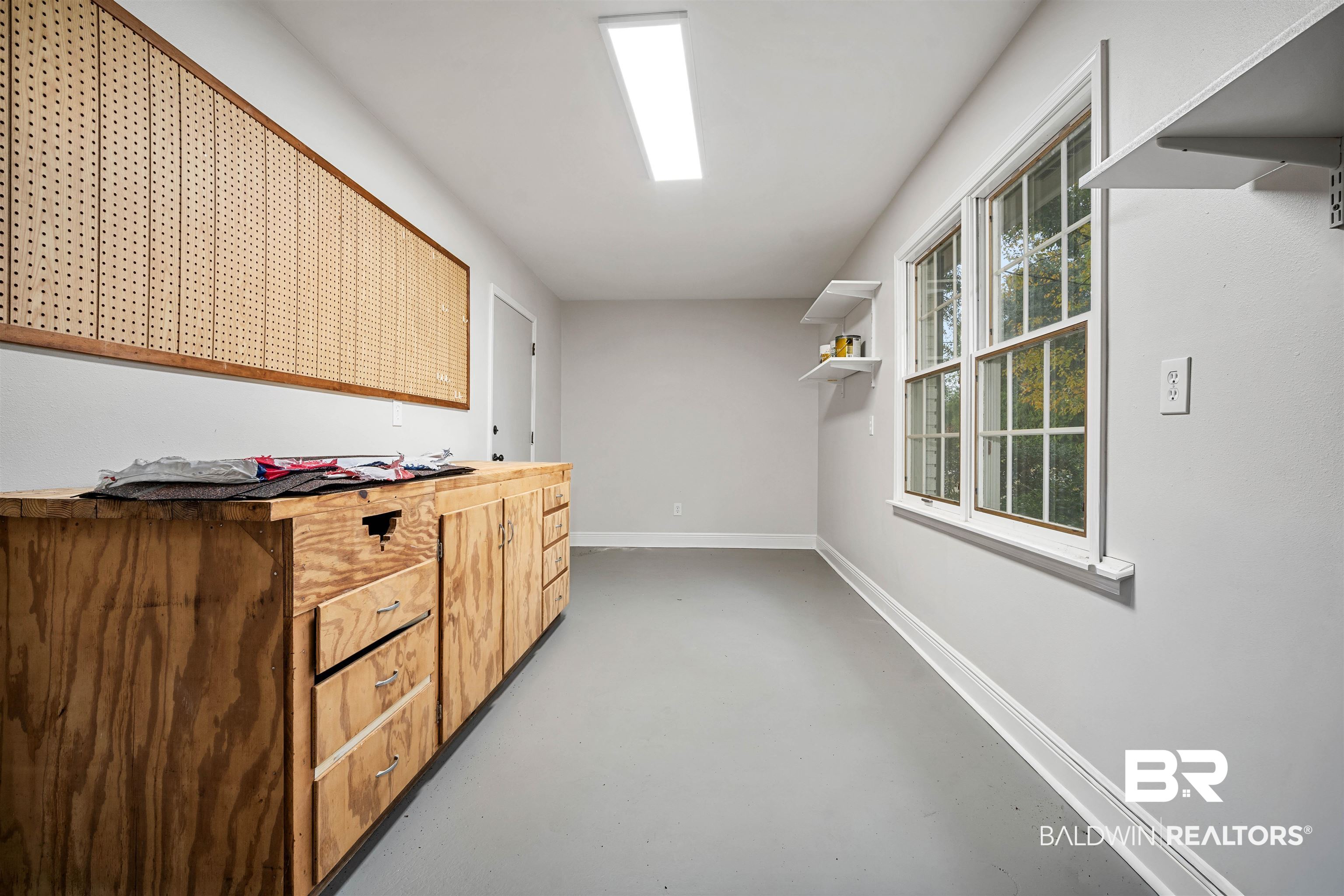 3050 Lacoste Road Mobile, AL 36618 - Photo 25 of 30 Laundry room featuring concrete floors and baseboards