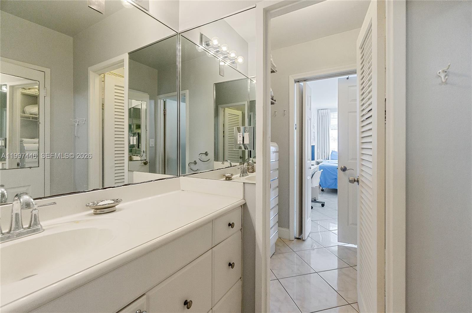 100 Lincoln Road, Unit 638 Miami Beach, FL 33139 - Photo 11 of 19 a bathroom with a sink and a mirror
