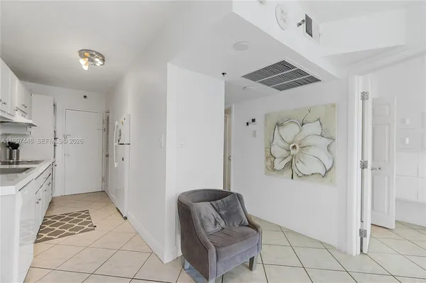 a living room with a couch and a rug