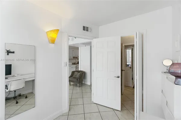 a view of a kitchen cabinets and a livingroom