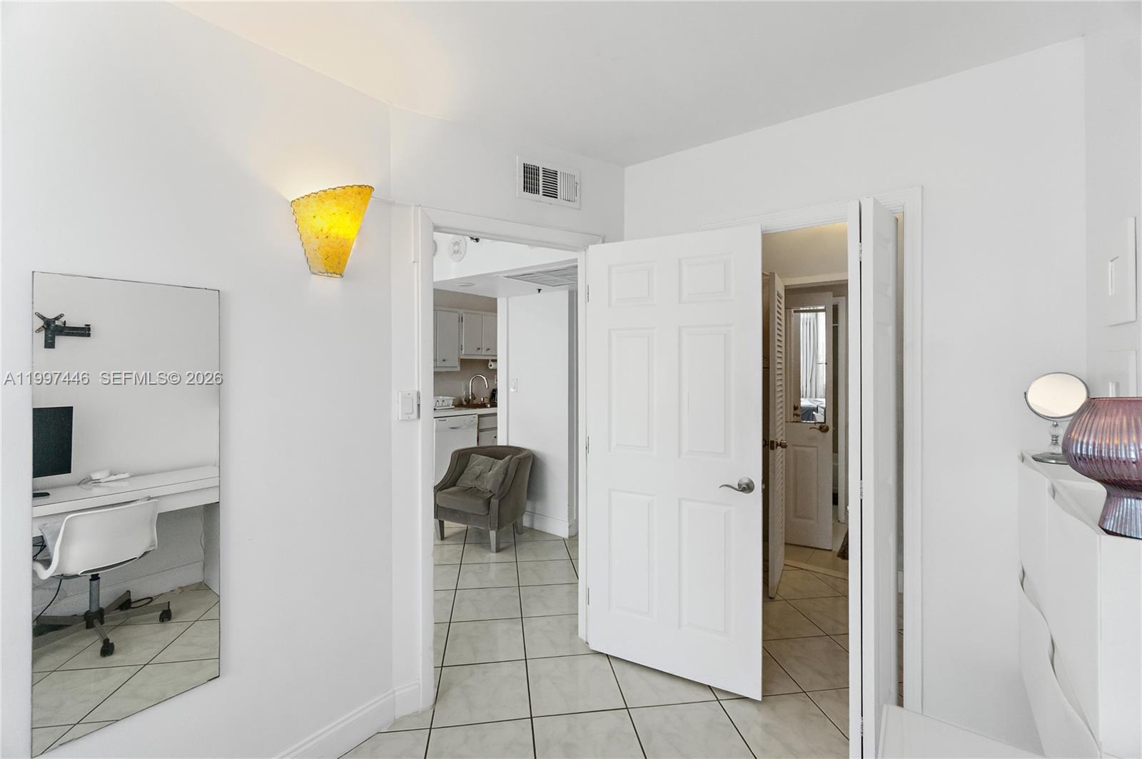 100 Lincoln Road, Unit 638 Miami Beach, FL 33139 - Photo 9 of 19 a view of a kitchen cabinets and a livingroom