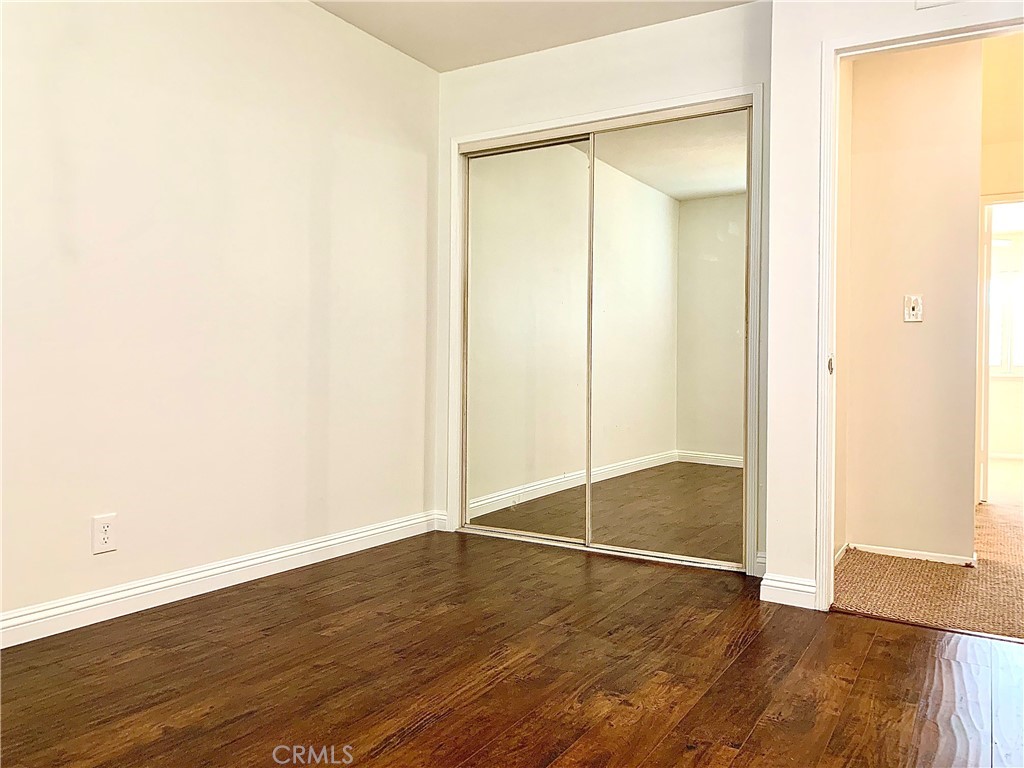 182 Brookline Lane Costa Mesa, CA 92626 - Photo 17 of 21 an empty room with wooden floor and shower