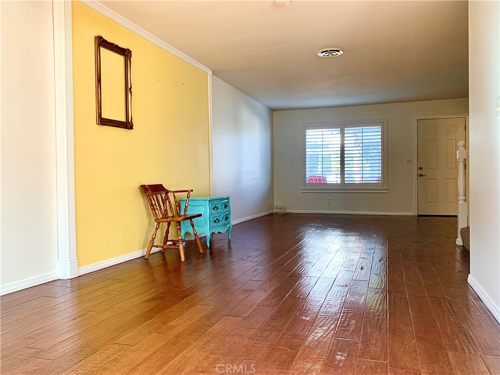 182 Brookline Lane Costa Mesa, CA 92626 - Photo 3 of 21 a dining room with wooden floor and a table