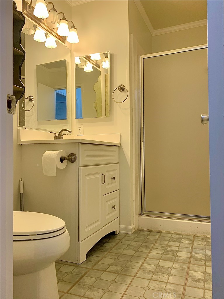 182 Brookline Lane Costa Mesa, CA 92626 - Photo 9 of 21 a bathroom with a sink a toilet and shower