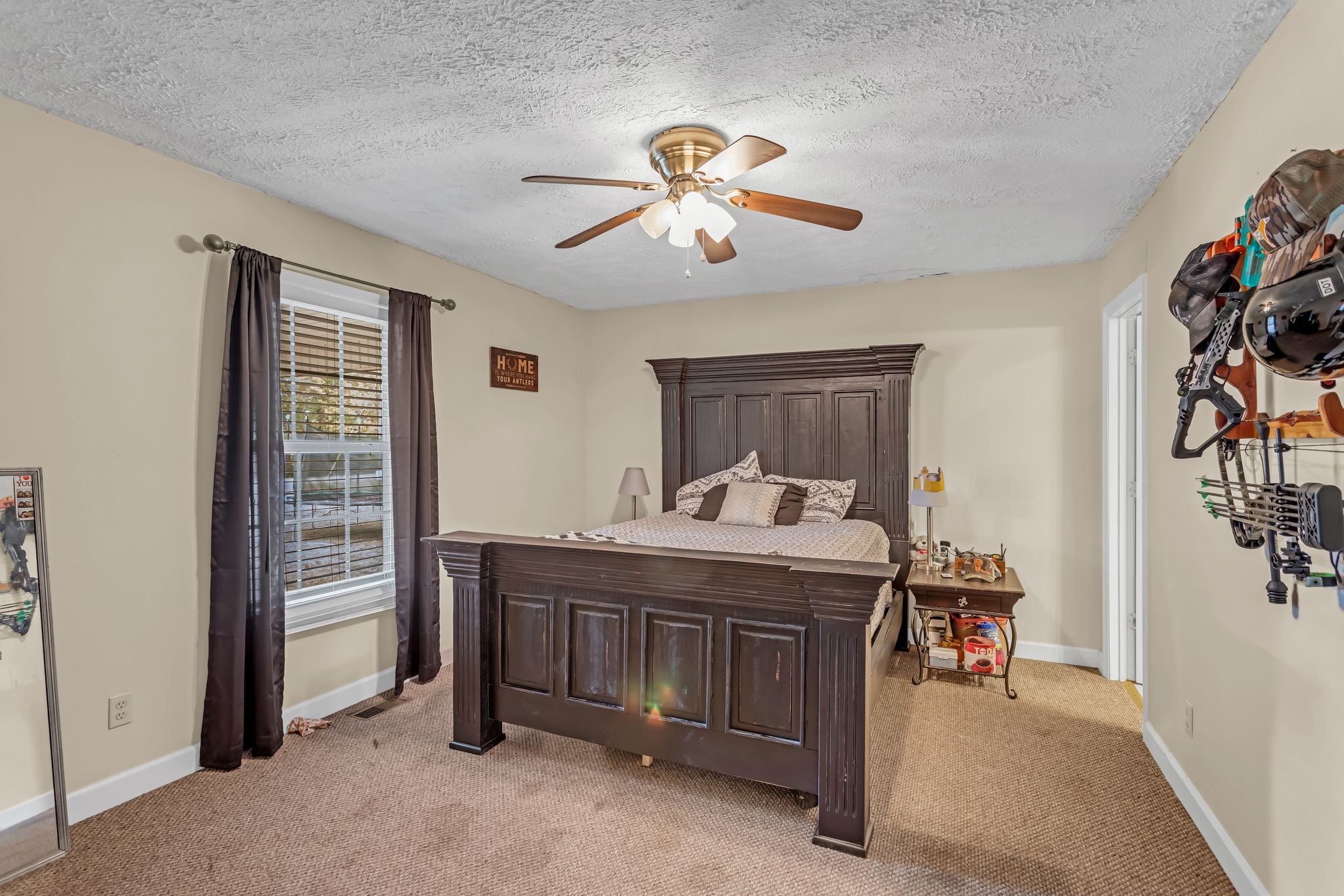 175 Reeves Road Hohenwald, TN 38462 - Photo 13 of 27 a view of a livingroom with furniture and a ceiling fan
