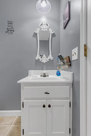 a bathroom with a sink and a mirror