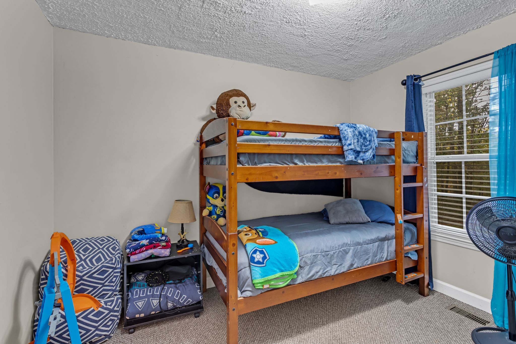 175 Reeves Road Hohenwald, TN 38462 - Photo 20 of 27 a bedroom with a bed and a window