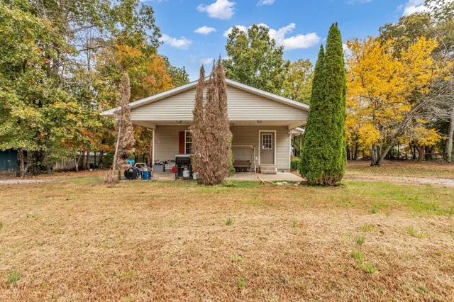 a backyard of a house with lots of green space
