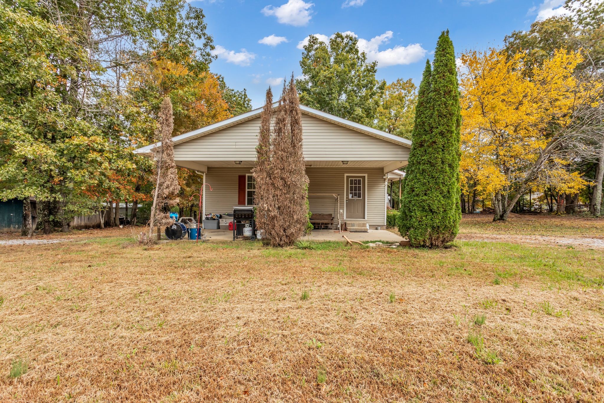 175 Reeves Road Hohenwald, TN 38462 - Photo 22 of 27 a view of a house with backyard and trees
