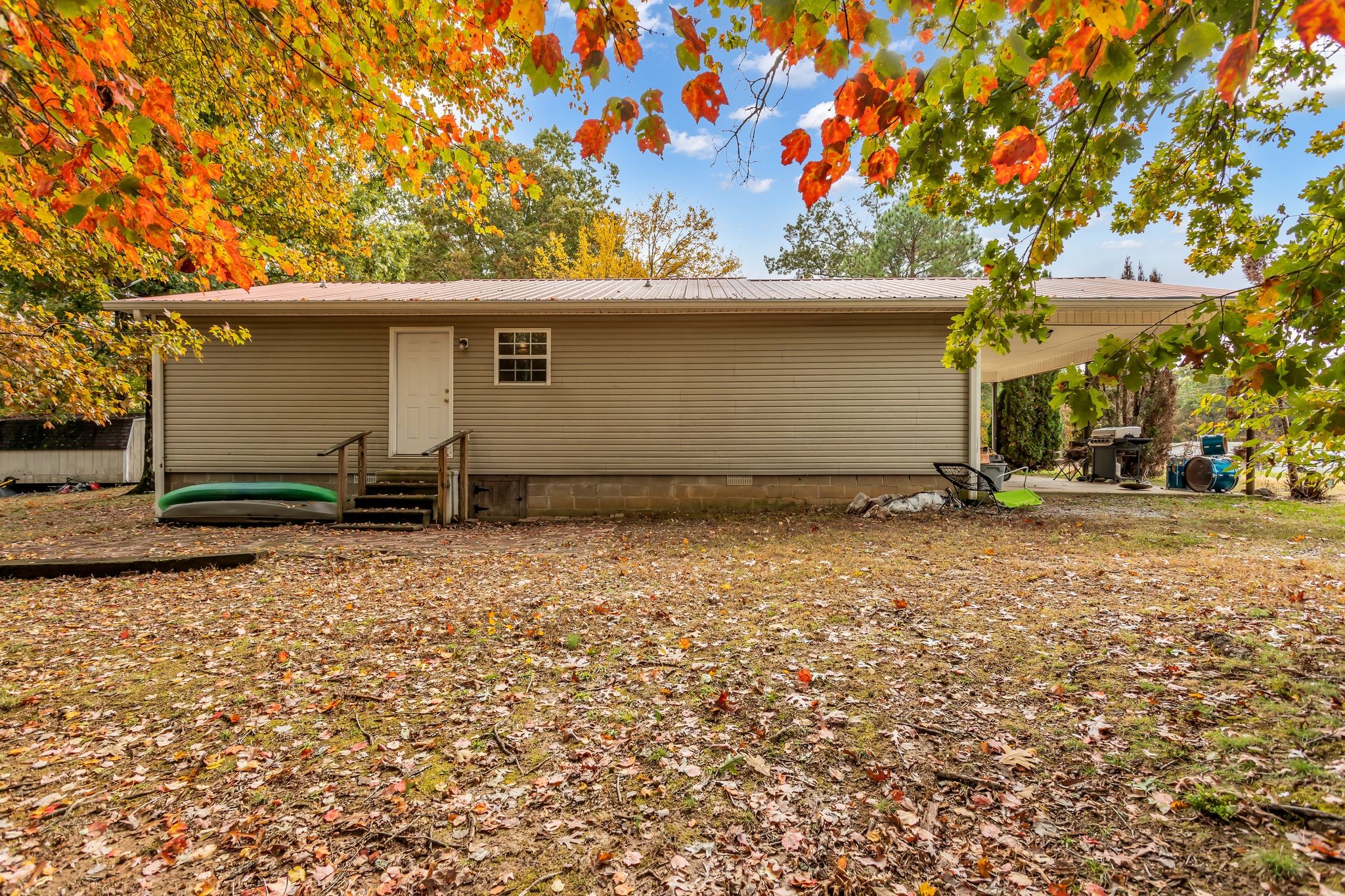 175 Reeves Road Hohenwald, TN 38462 - Photo 23 of 27 a backyard of a house with lots of green space