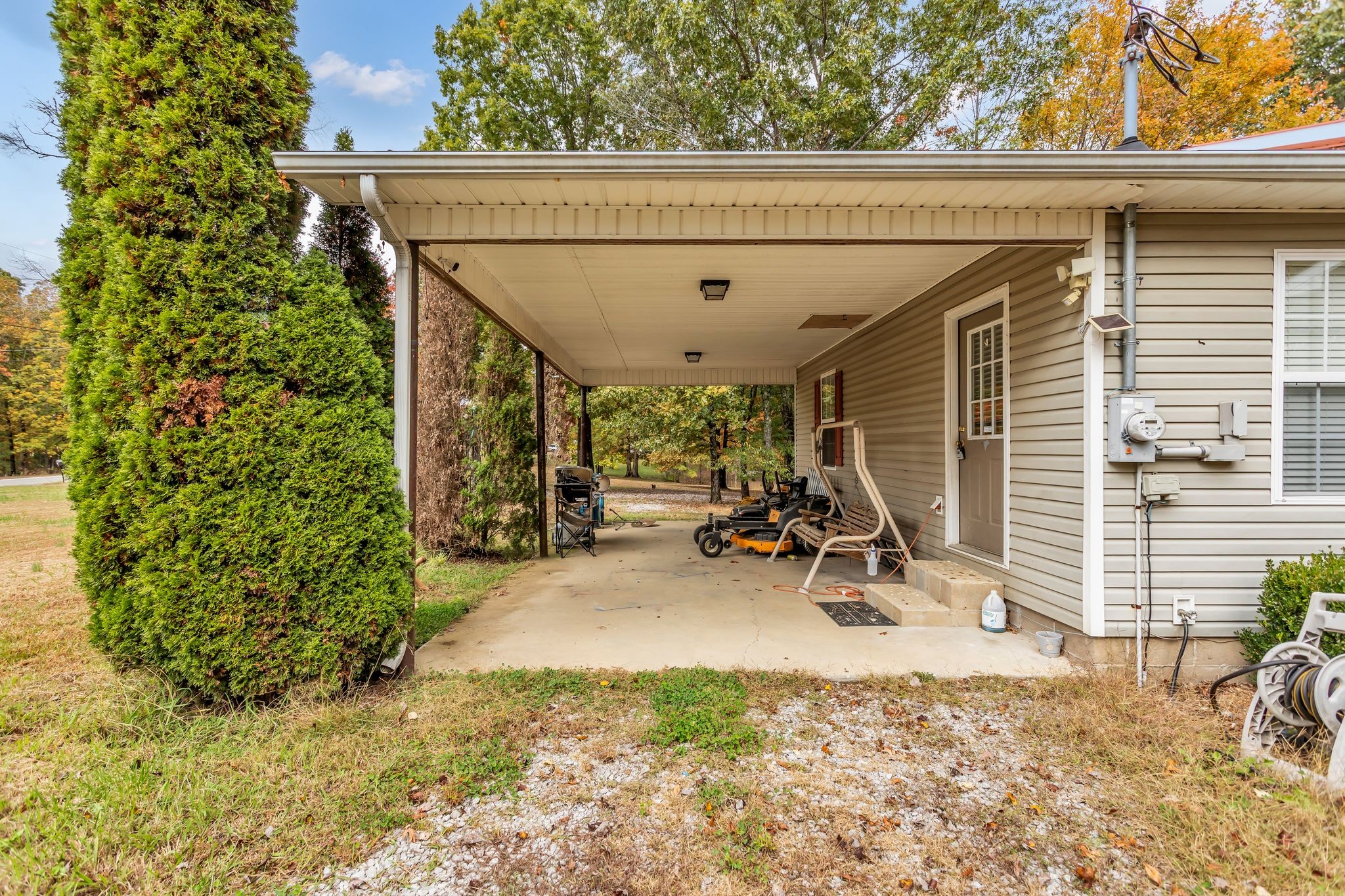 175 Reeves Road Hohenwald, TN 38462 - Photo 25 of 27 a view of a garage with parked cars