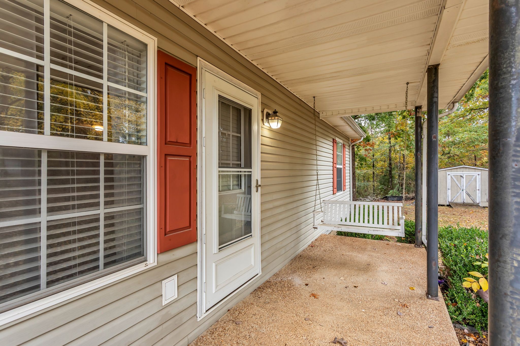 175 Reeves Road Hohenwald, TN 38462 - Photo 4 of 27 a view of a porch with a wooden fence