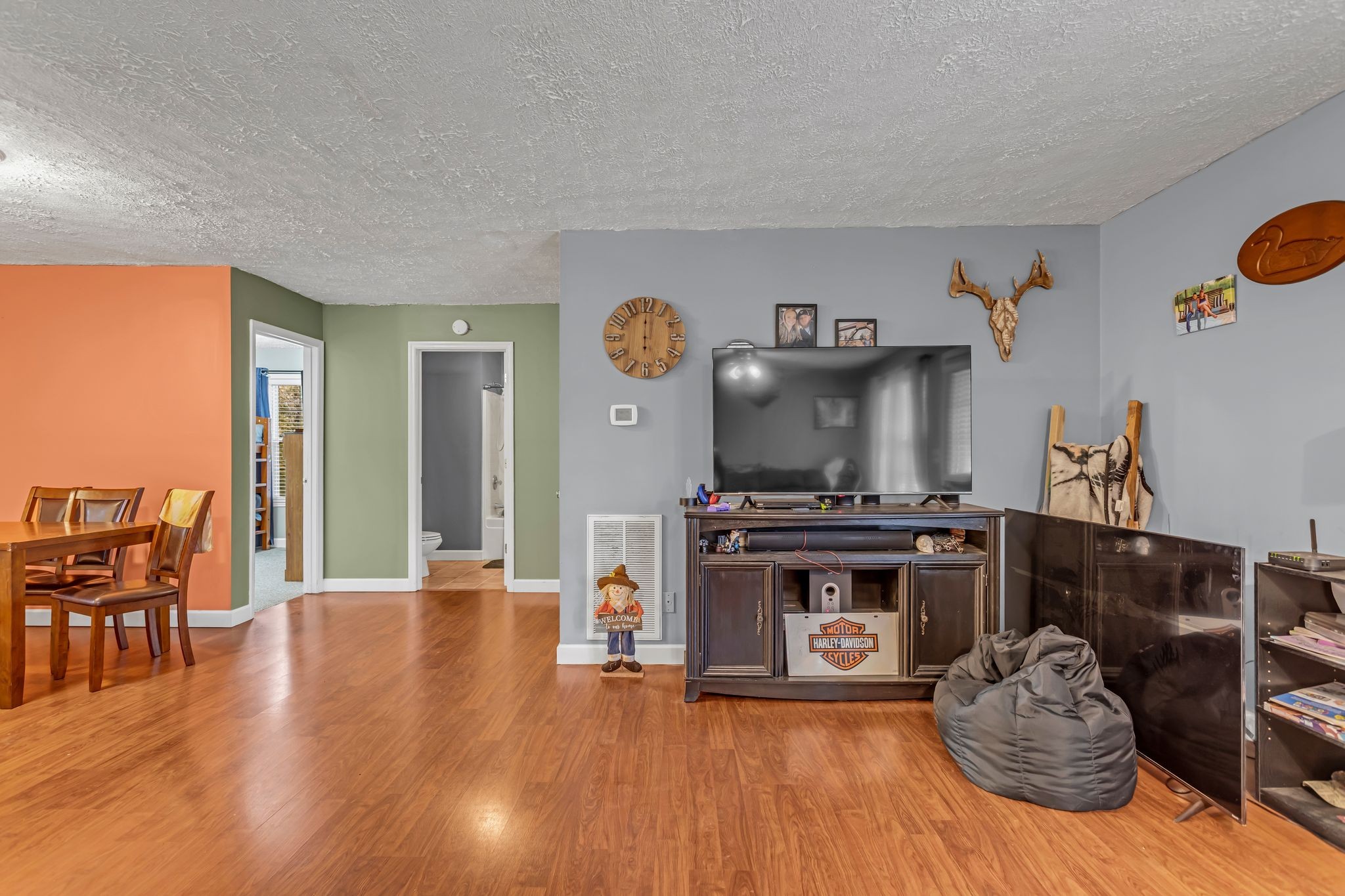 175 Reeves Road Hohenwald, TN 38462 - Photo 6 of 27 a kitchen with stainless steel appliances granite countertop a stove and a wooden floors