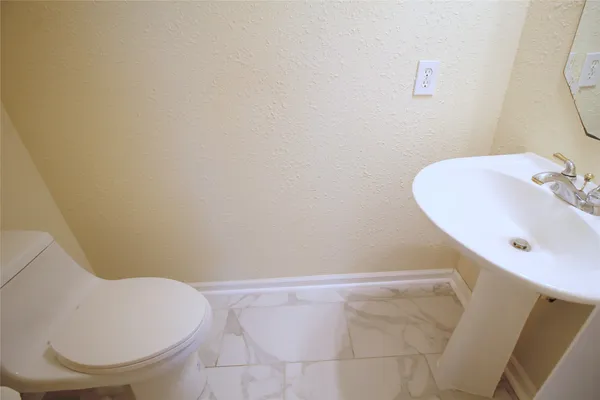 a bathroom with a sink and a toilet