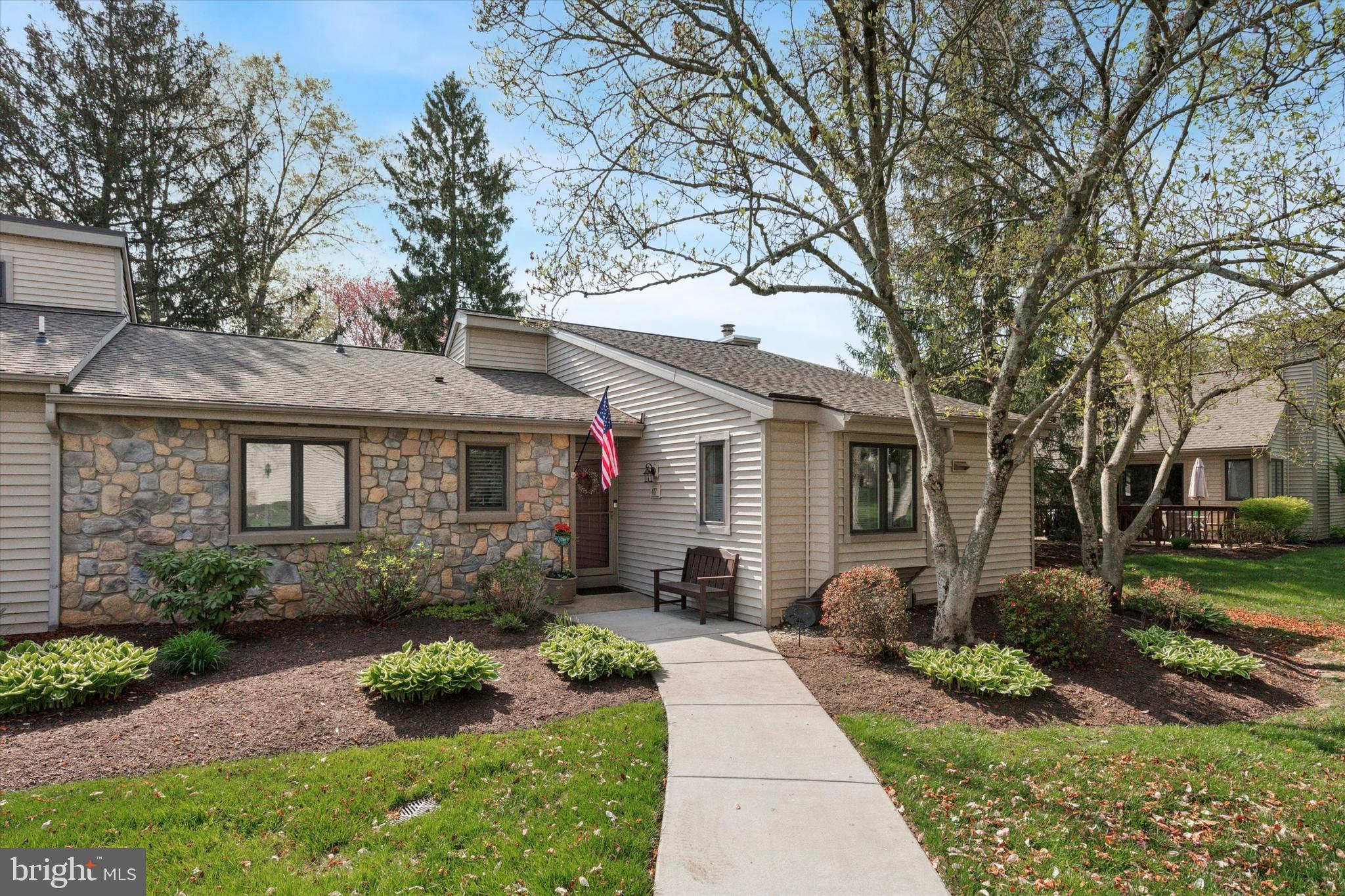 417 Eaton Way West Chester, PA 19380 - Photo 1 of 25 a front view of a house with garden
