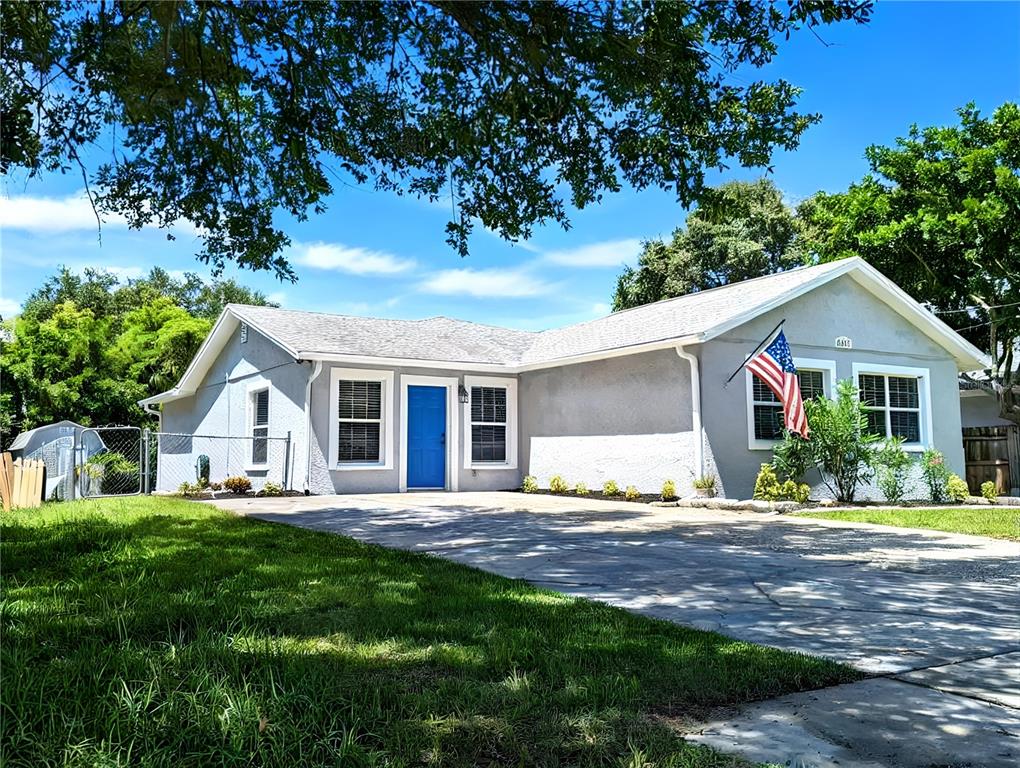 6811 South Himes Avenue Tampa, FL 33611 - Photo 1 of 39 a front view of house with yard and green space