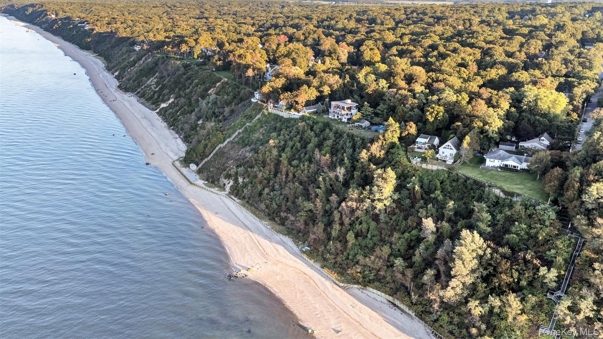 81 Beach Road Wading River, NY 11792 - Photo 14 of 25 Aerial view of property's location featuring unending shoreline and a heavily wooded area