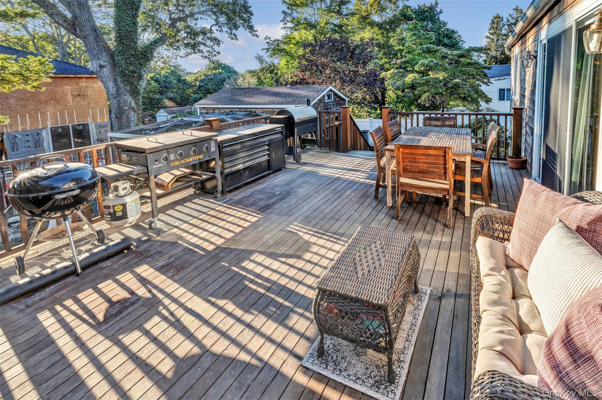 81 Beach Road Wading River, NY 11792 - Photo 16 of 25 Wooden terrace with outdoor dining space and a grill