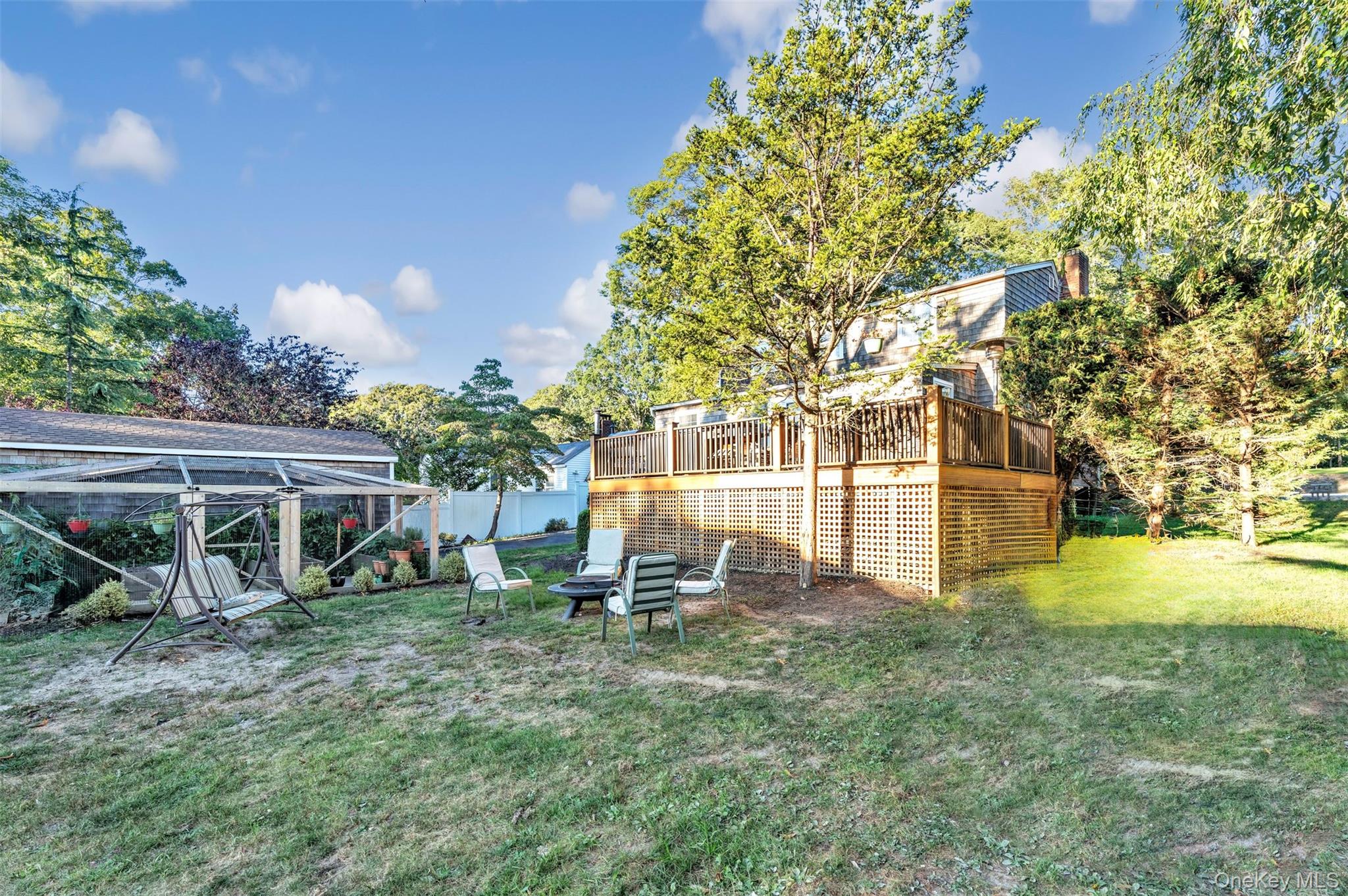 81 Beach Road Wading River, NY 11792 - Photo 18 of 25 View of yard featuring a deck