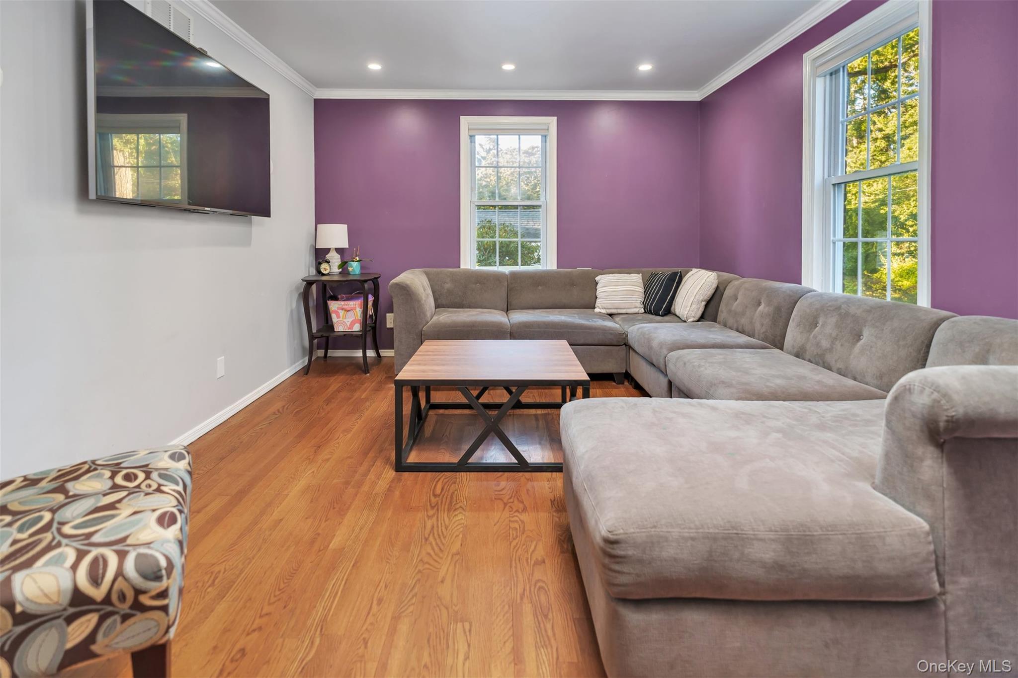 81 Beach Road Wading River, NY 11792 - Photo 19 of 25 Living room featuring ornamental molding, wood finished floors, and recessed lighting