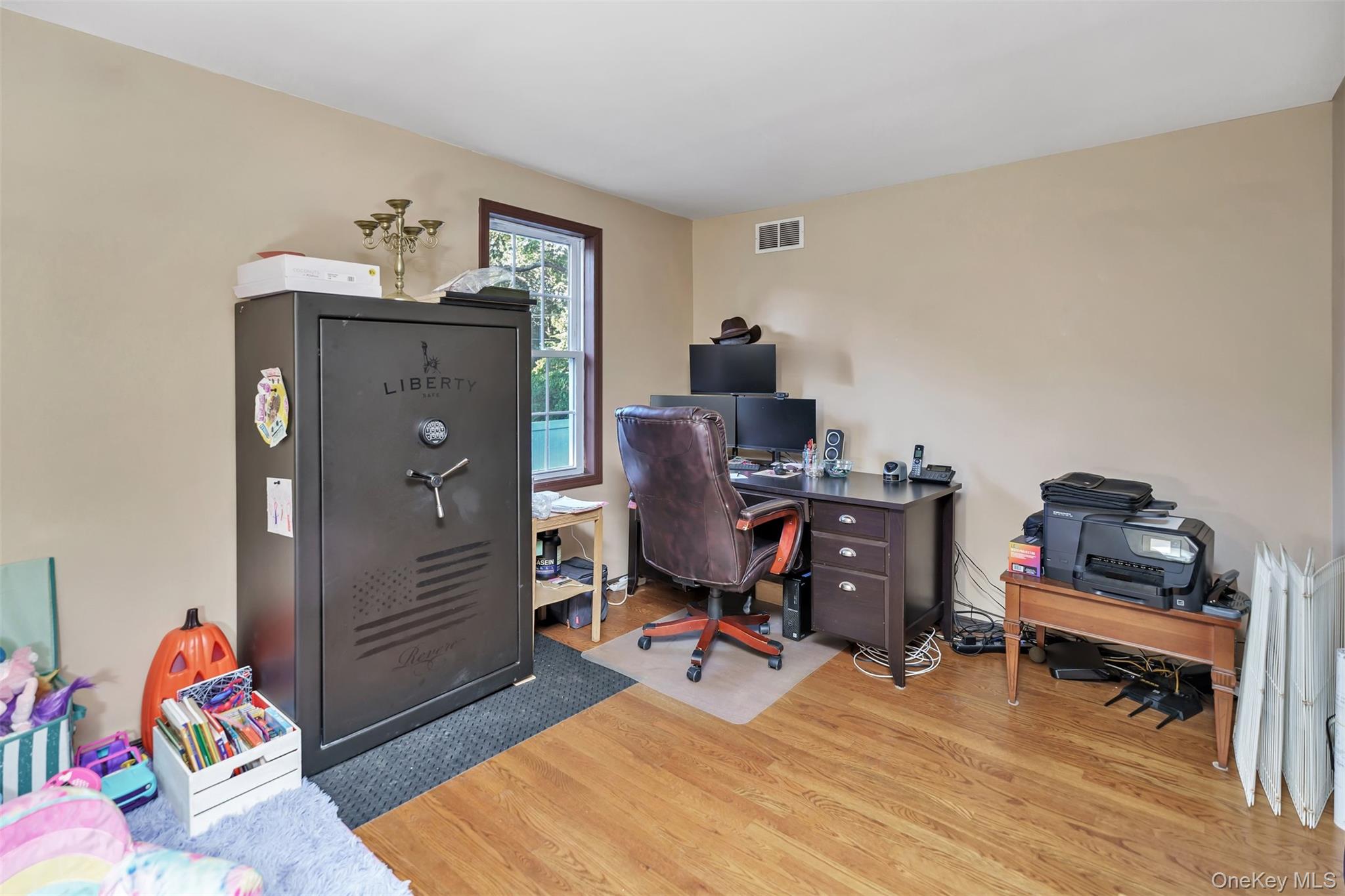 81 Beach Road Wading River, NY 11792 - Photo 10 of 25 1st Floor Bedroom/Office area featuring light wood finished floors