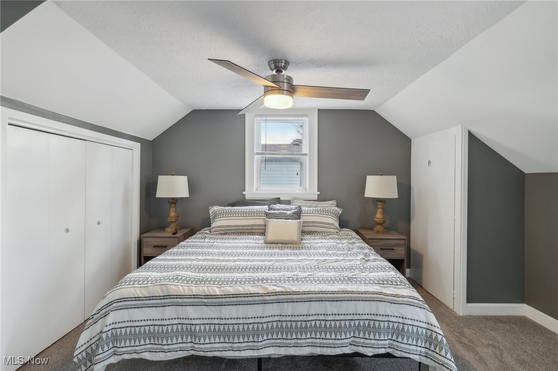 1567 Roselawn Road Cleveland, OH 44124 - Photo 17 of 29 Bedroom featuring ceiling fan, a closet, lofted ceiling, and carpet floors