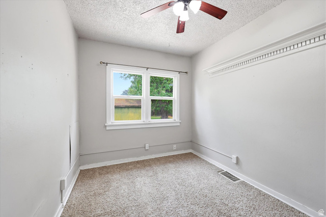 262 West 400 South Springville, UT 84663 - Photo 13 of 17 Carpeted room with a ceiling fan, crown molding, and a double-hung window