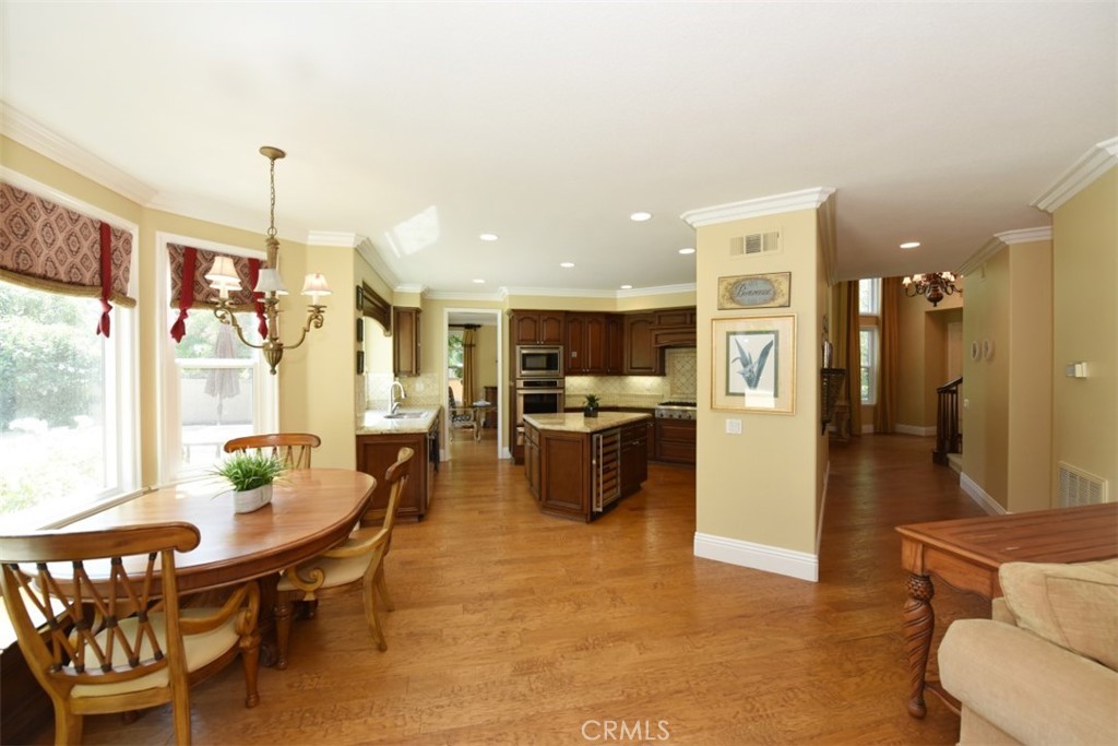 12 Brigadier Irvine, CA 92603 - Photo 22 of 50 a living room with furniture a dining table and kitchen view